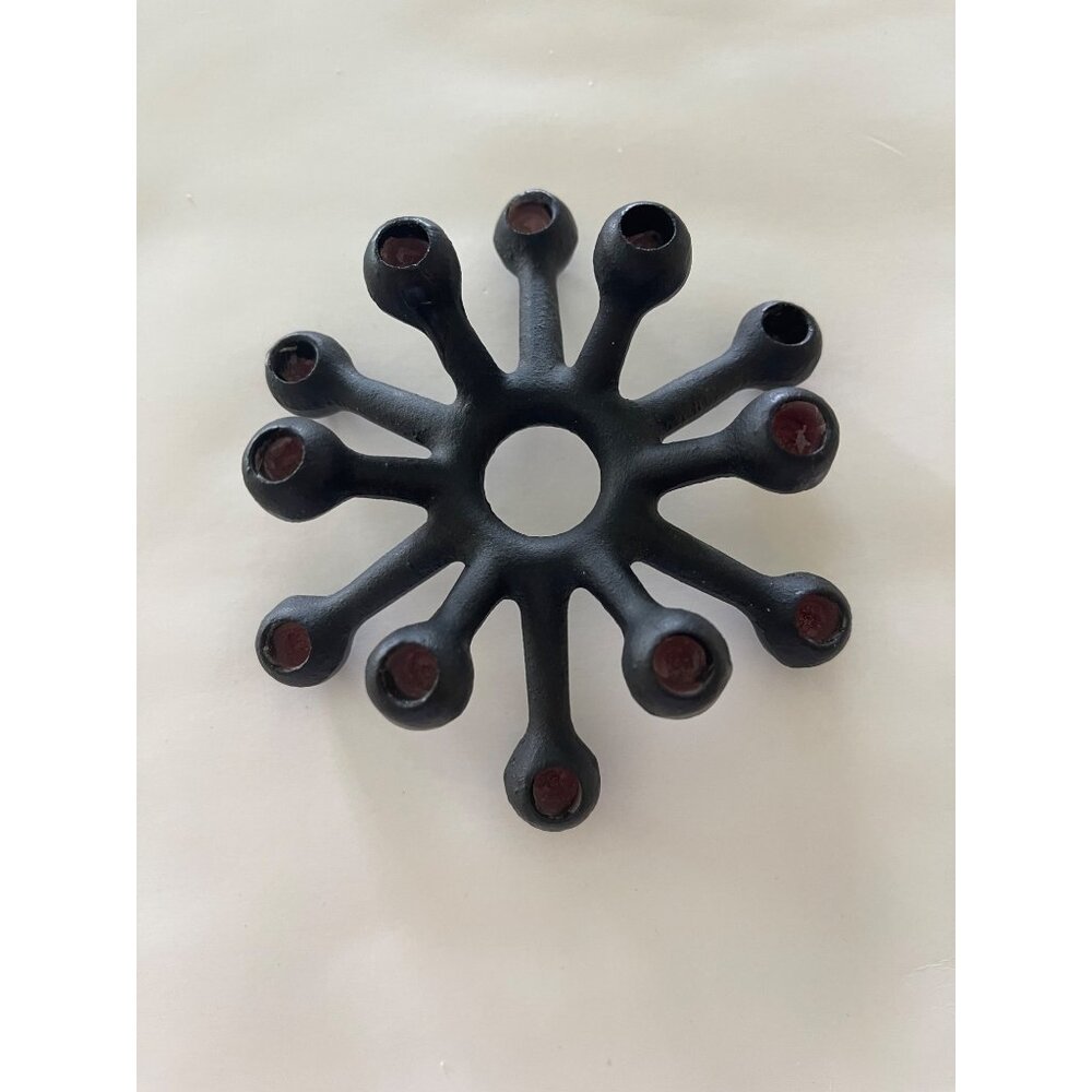 Candlestick by Jens Quistgaard for DANSK Designs, 1962. Cast iron candleholder f